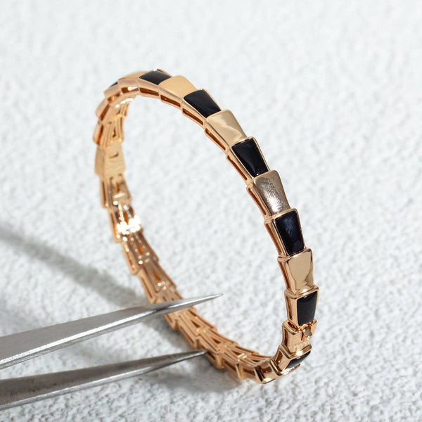<chiba> SERPENTI ARMBAND ROTGOLD ONYX</chiba>